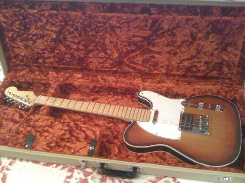 Finished electric guitar in case